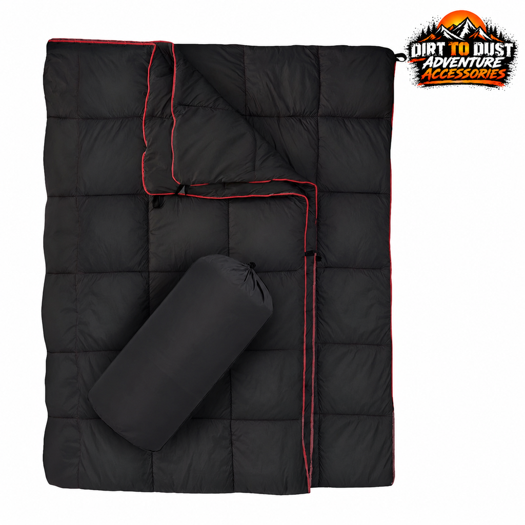 Black quilted camping blanket with red edging and matching drawstring storage bag
