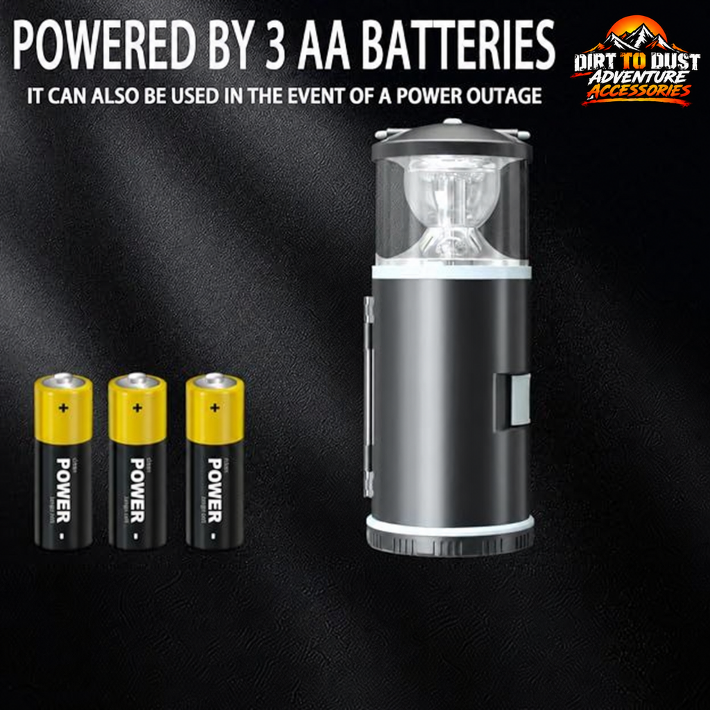Black battery-powered LED camping lantern with three AA batteries and Dirt to Dust Adventure Accessories branding
