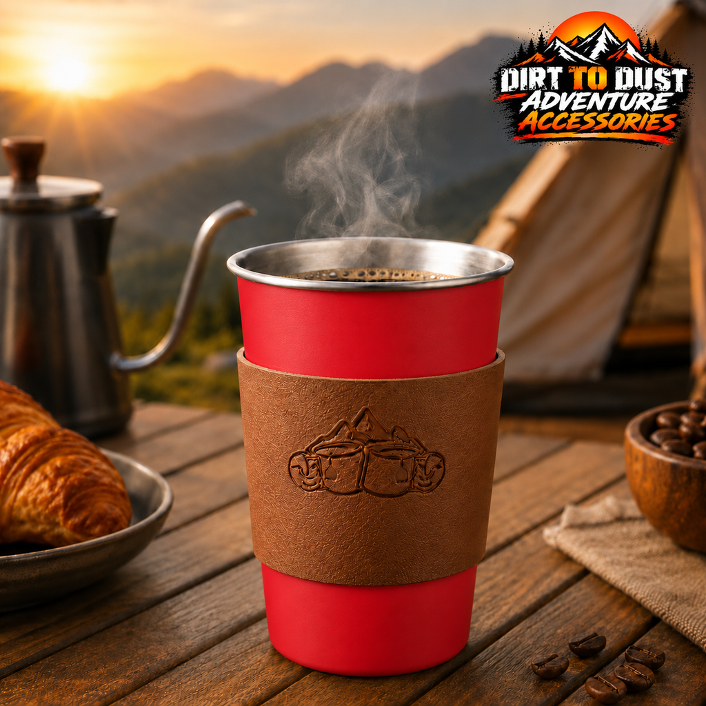 Red 500 ml camping cup with a removable tan sleeve at a campsite, branded Dirt to Dust Adventure Accessories.