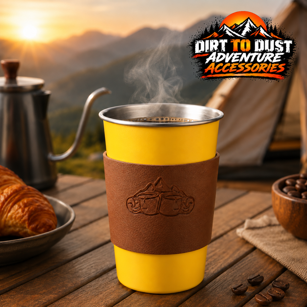 Yellow 500 ml camping cup with tan sleeve at a campsite, with Dirt to Dust Adventure Accessories logo.